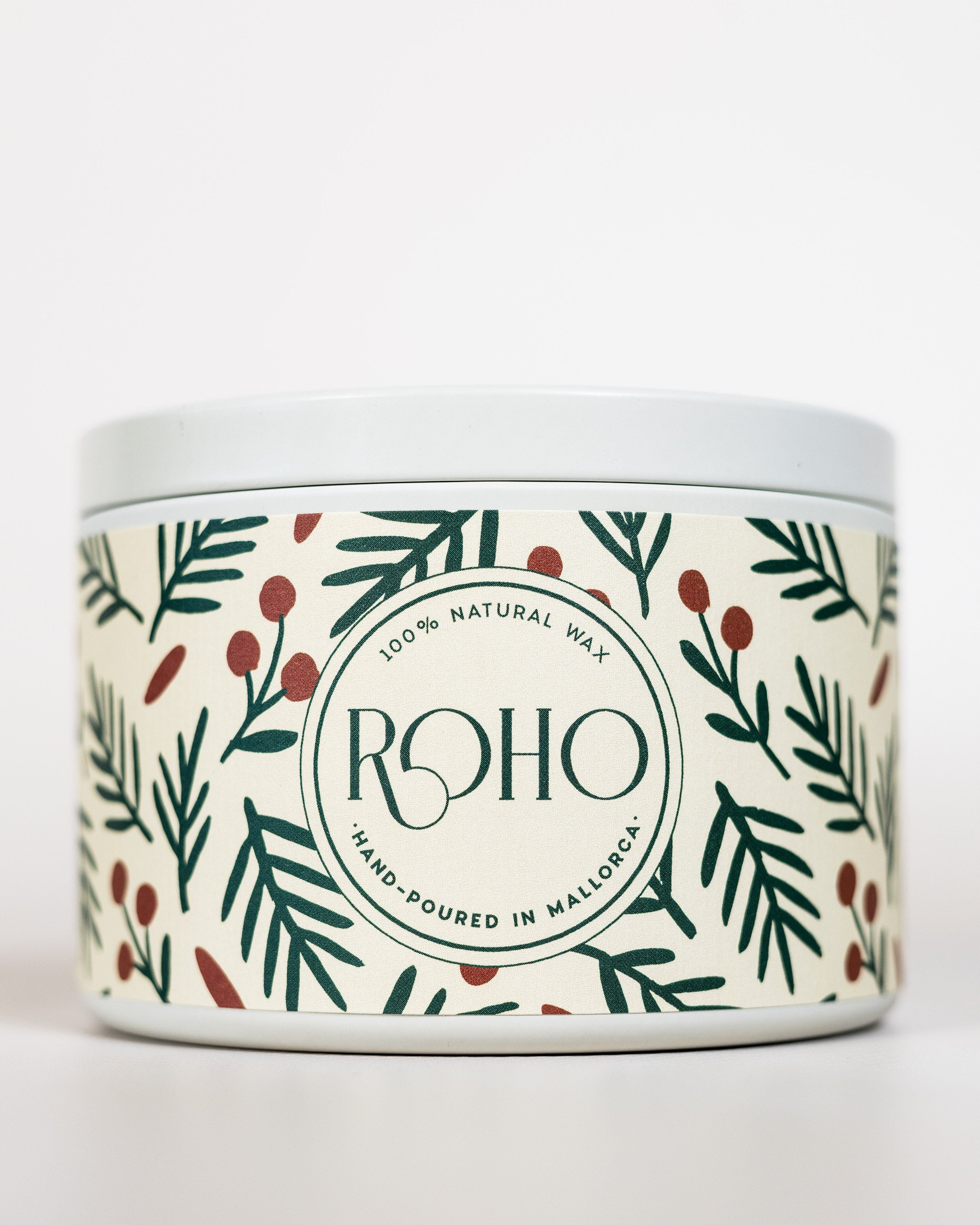 Scented candle with winter collection label featuring green leaves and berries on a white background, Christmas Gift
