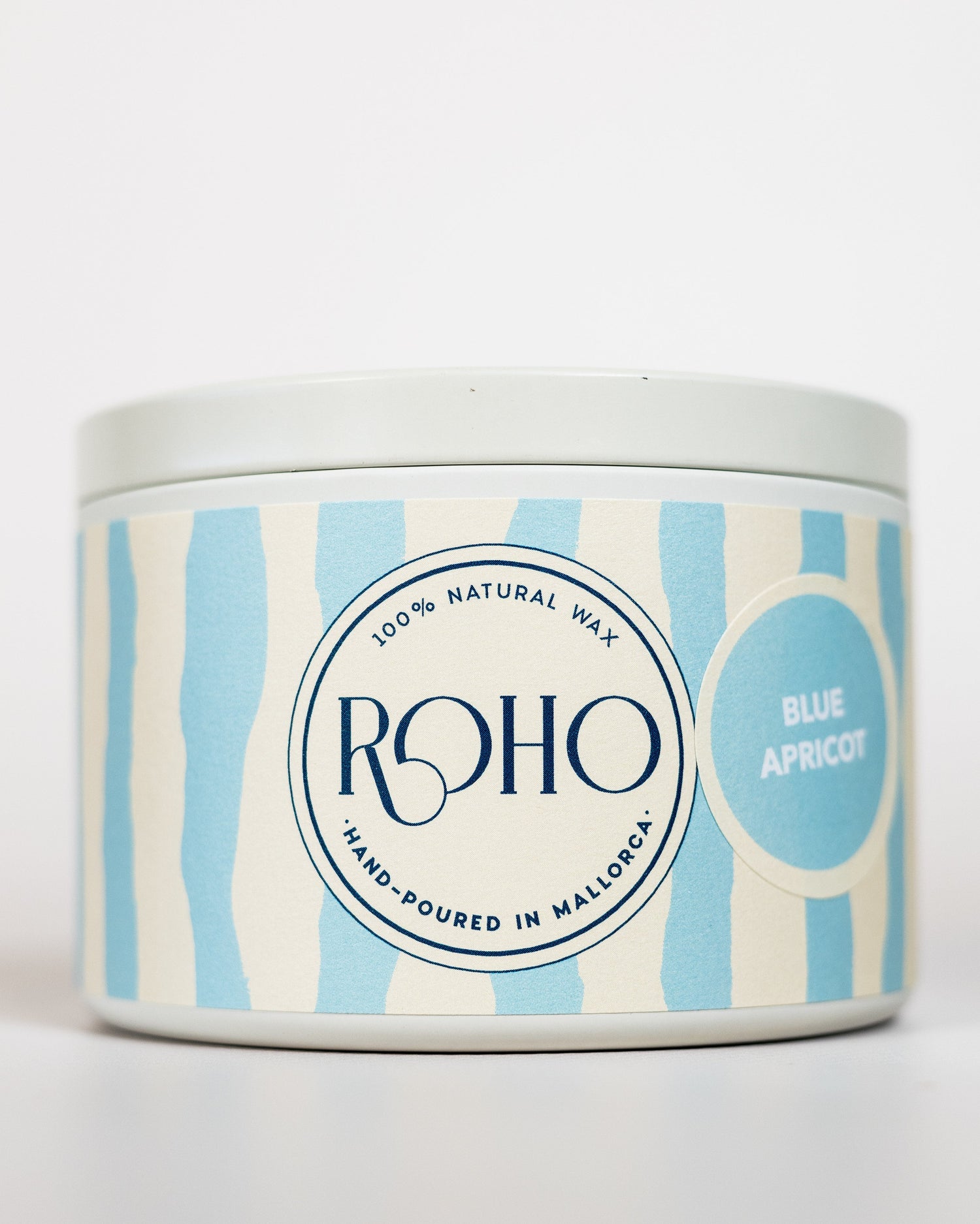 Candle tin with blue and white striped design and &