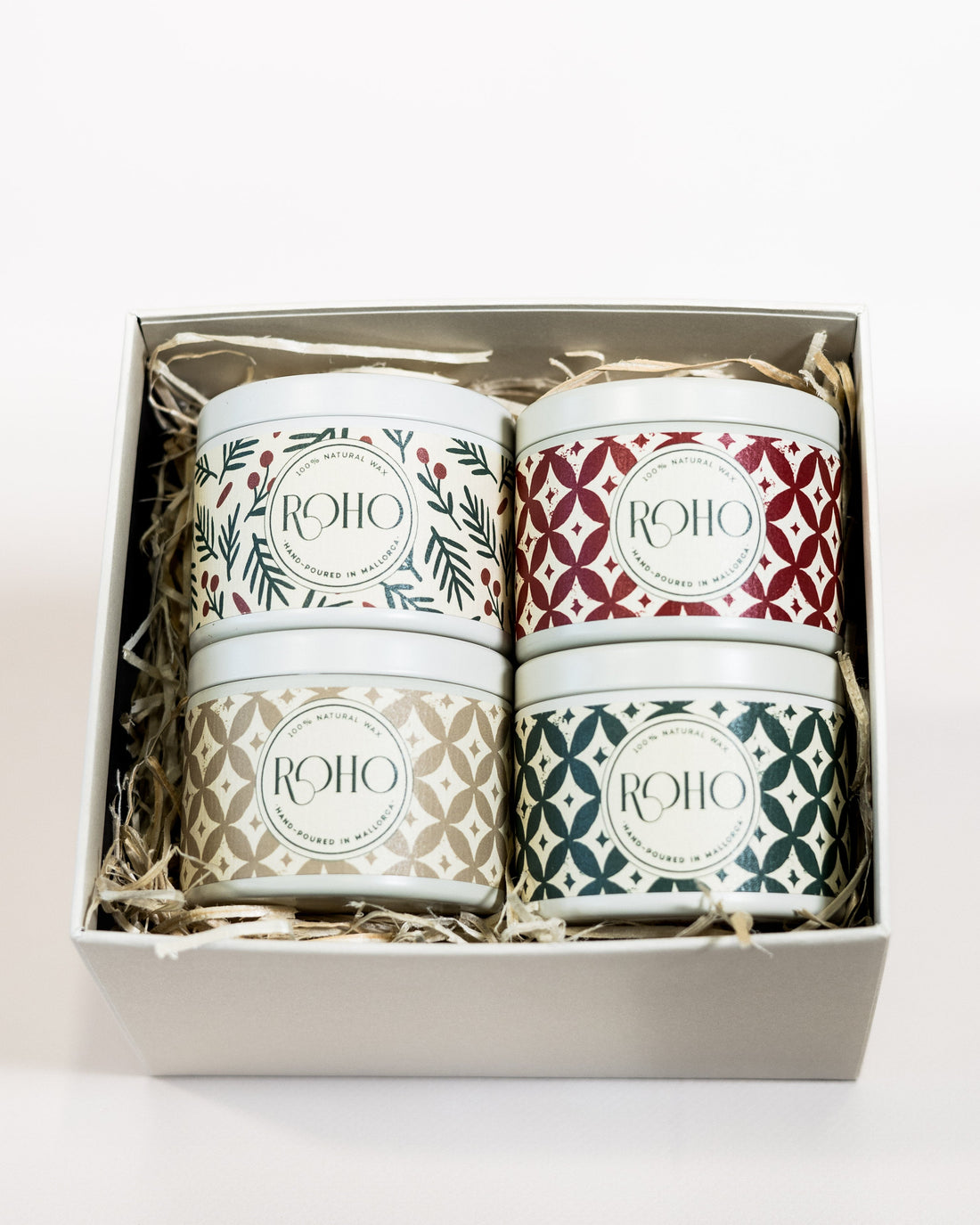 Set of four candles in a box with &