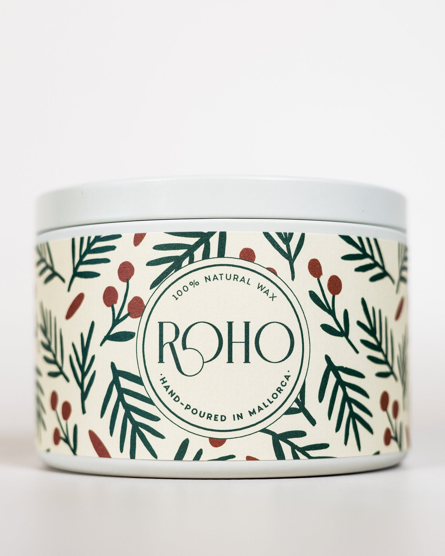 Scented candle with winter collection label featuring green leaves and berries on a white background, Christmas Gift