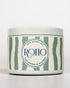 Candle jar with green and white striped design and &