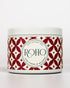 Scented Candle with red and white pattern label and &